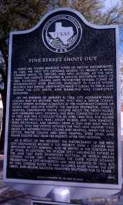 Historic marker for the Pine Street Shoot Out.