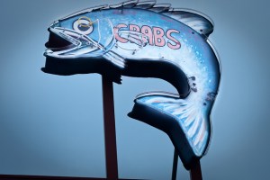 Fish sign advertising crabs.