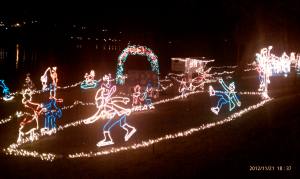 Ice skaters in lights.