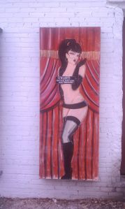 A sultry lady in the alley.