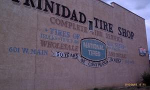 An old tire store recycled becomes a liquor store.