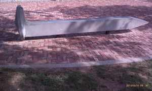 That railroad spike is a park bench.