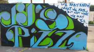 Art and poetry hide the dumpster.