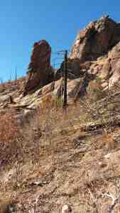 Just off the trail stands a tower.