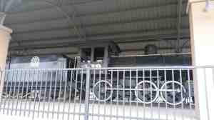 A steam engine by the river.