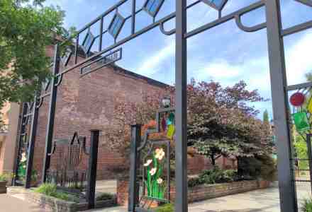 Ornate gateway at entry to a small plaza.