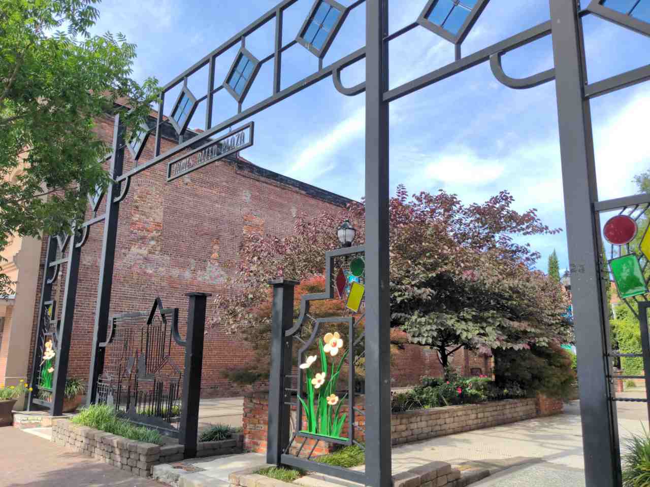Ornate gateway at entry to a small plaza.