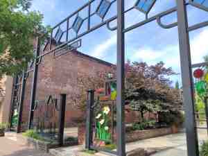 Ornate gateway at entry to a small plaza.