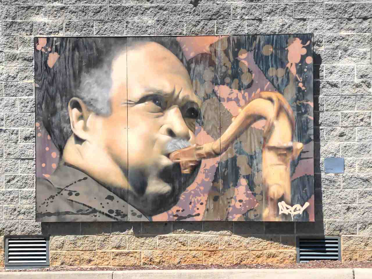 Mural of a musician playing a saxophone.