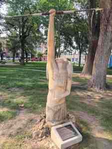 Carved sculpture called "Cry to the Ages" in the town plaza.