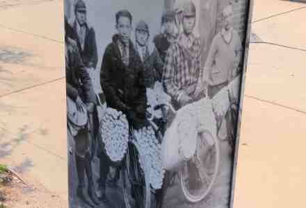 Utility box with mini mural of paper boys.