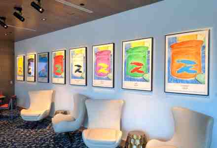 Hotel lobby area with art deco furnishings and original art on the walls.