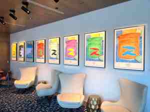 Hotel lobby area with art deco furnishings and original art on the walls.