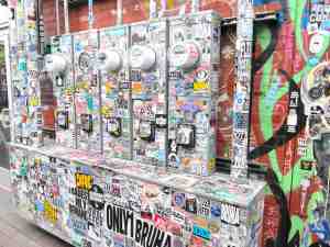 Utility meter boxes covered over with stickers.